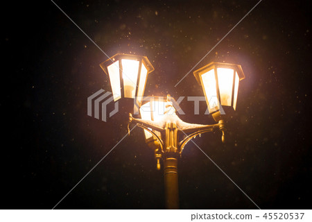 lantern during a snowfall 45520537