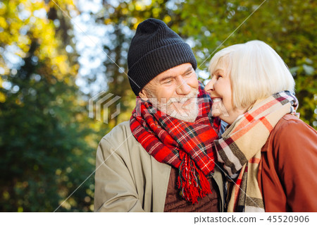 Cheerful happy woman smiling to her husband Cheerful happy woman smiling to her husband 45520906