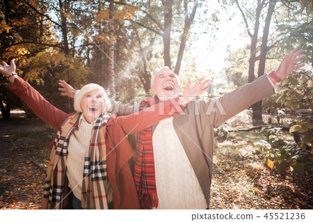 Joyful delighted couple having fun in the forest 45521236