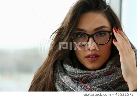 Young beautiful woman in a scarf portrait is Young beautiful woman in a scarf portrait is 45521572