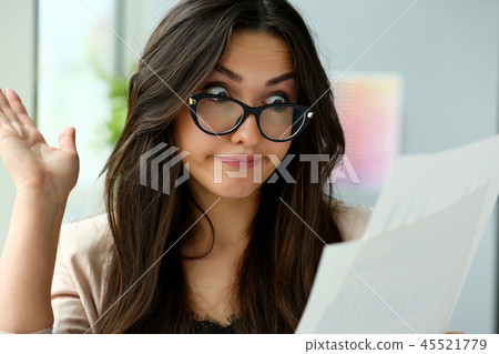 Young beautiful business woman holding glasses 45521779