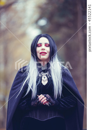 Image of vampire woman with eyes closed with blood at mouth Image of vampire woman with eyes closed with blood at mouth 45522141