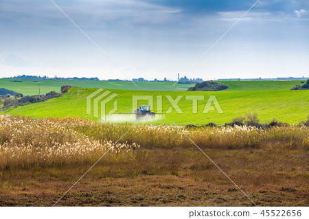 Tractor spraying the chemicals Tractor spraying the chemicals 45522656