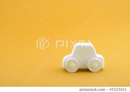 Car toy on orange background Car toy on orange background 45523031