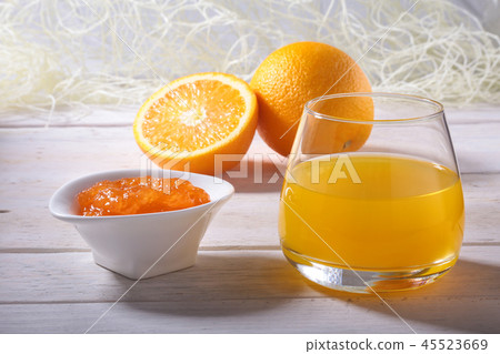 Orange jam and juice in glass. Morning breakfast. 45523669