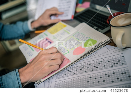 Selective focus of a pencil being in male hands 45525678