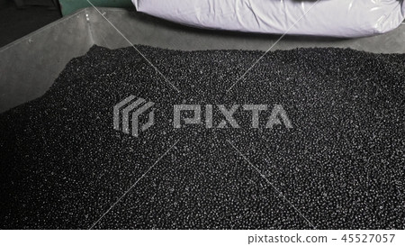 Plastic black gray granulated crumb. Manufacture of plastic water pipes factory. Process of making Plastic black gray granulated crumb. Manufacture of plastic water pipes factory. Process of making 45527057