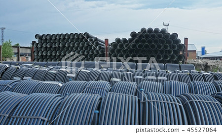 Warehouse of finished plastic pipes industrial outdoors storage site. Manufacture of plastic water Warehouse of finished plastic pipes industrial outdoors storage site. Manufacture of plastic water 45527064