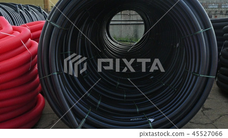 Warehouse of finished plastic pipes industrial outdoors storage site. Manufacture of plastic water Warehouse of finished plastic pipes industrial outdoors storage site. Manufacture of plastic water 45527066