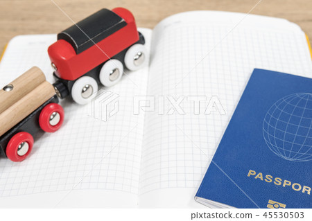 wooden train on a diary with passport 45530503