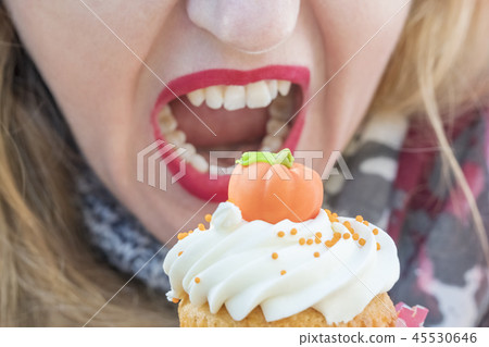 Female mouth eating a cake Female mouth eating a cake 45530646