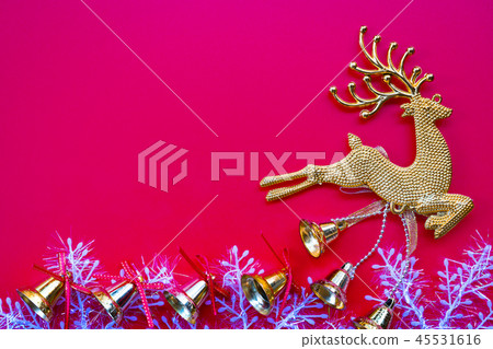 Christmas gold reindeer and bell on red background 45531616