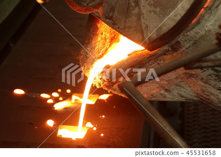 Iron molten metal pouring in sand mold 45531658