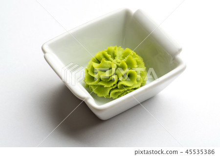 Portion of wasabi in a white gravy boat. Portion of wasabi in a white gravy boat. 45535386