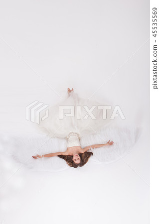 Girl with angel wings on white background 45535569