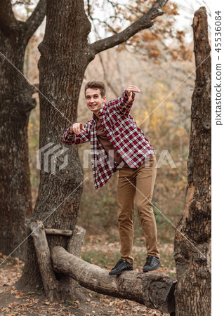 Handsome young guy in nature on an autumn day 45536084