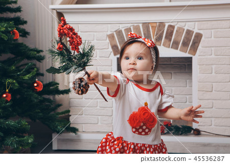 little girl posing against the fireplace, Christma 45536287