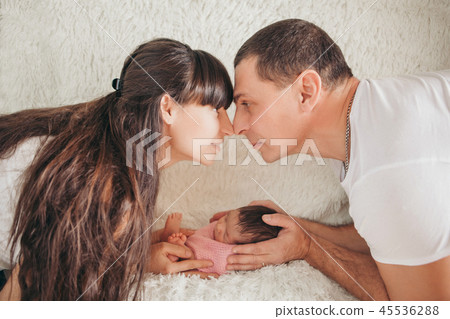 the baby on the hands of parents the baby on the hands of parents 45536288