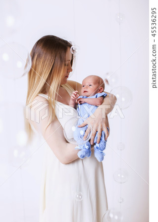 Woman holding a child Woman holding a child 45536295