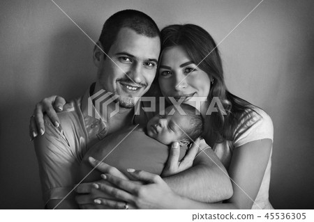 baby on hands of parents on a white background. baby on hands of parents on a white background. 45536305