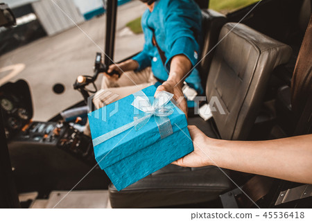 Close up of bearded man giving the present from helicopter 45536418