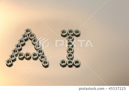 字母“AI”用六角螺母寫在不銹鋼板上。 45537225