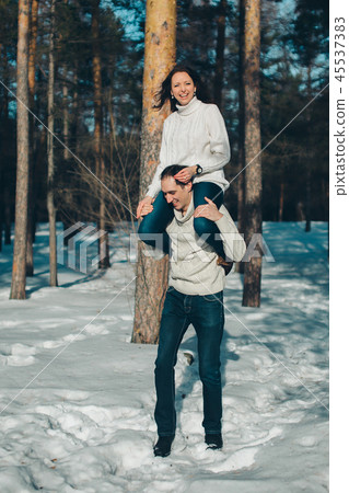 man and woman playing in the snow man and woman playing in the snow 45537383