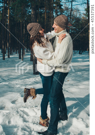 man and woman playing in the snow man and woman playing in the snow 45537391