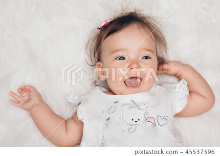 portrait of a little girl: baby's face close-up portrait of a little girl: baby's face close-up 45537396