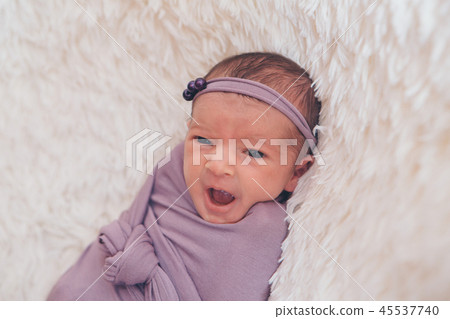 the face of a schild with a bandage on his head 45537740