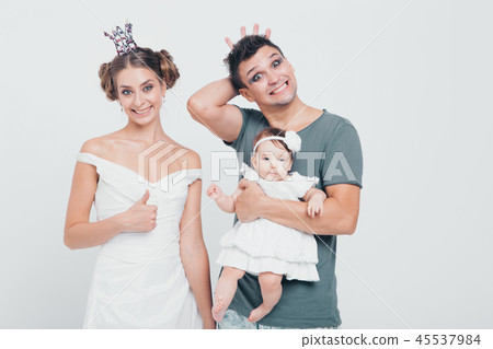 a little girl in hands of the Prince and Princess a little girl in hands of the Prince and Princess 45537984