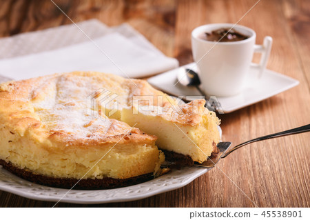 Homemade vanilla cheesecake and cup of coffee. 45538901