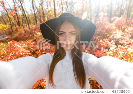 happy woman in black hat making selfie happy woman in black hat making selfie 45538903