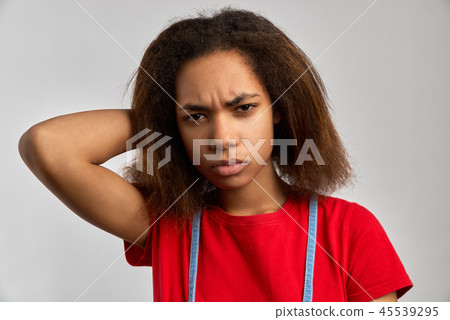 Portrait of an outraged woman frowning eyebrows 45539295
