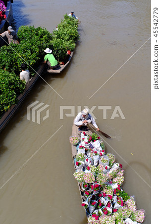 Cargo boat carrying flowers in Vietnam Cargo boat carrying flowers in Vietnam 45542779