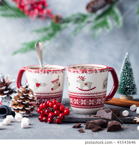 Hot chocolate with marshmallows in Christmas mugs on grey background. Copy space. Close up. 45543646