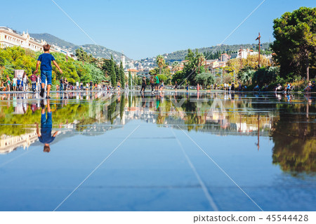 Nice, France August 11, 2018: Children playing in the water park Nice, France August 11, 2018: Children playing in the water park 45544428