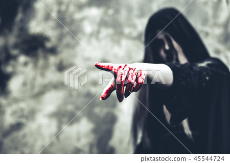 Close up of bloody ghost hand pointing to the front. Horror and 45544724
