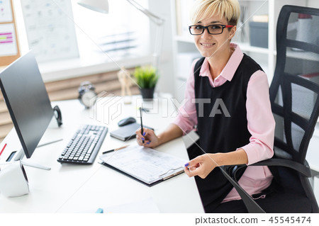 Young girl fills out documents 45545474