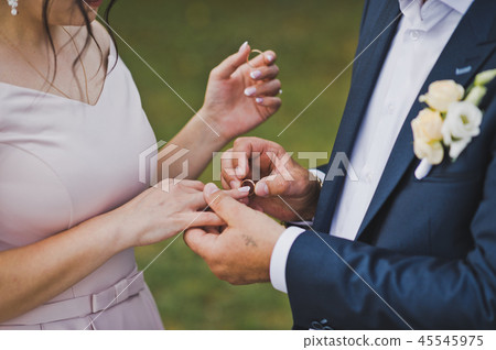 The gentle embrace of the newlyweds palms 1827. 45545975