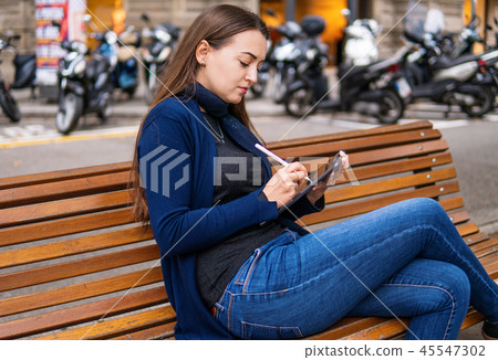 woman drawing on digital tablet with stylus pencil. 45547302