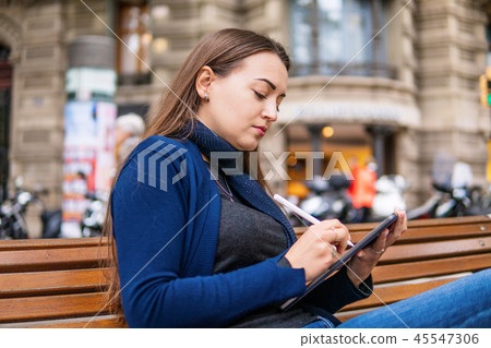 woman drawing on digital tablet with stylus pencil. 45547306