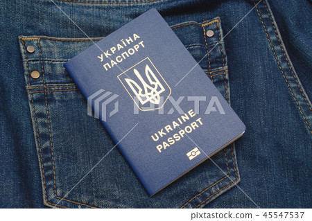 Biometric passport of Ukraine on jeans pocket. Biometric passport of Ukraine on jeans pocket. 45547537