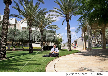 Man on the lawn in Ben Gurion University campus Man on the lawn in Ben Gurion University campus 45548625