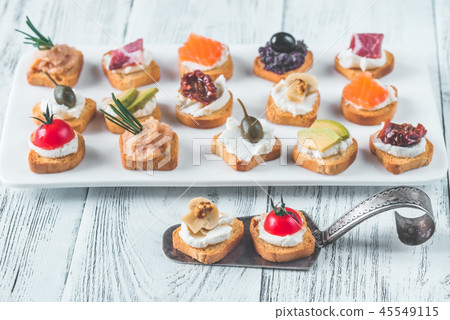 Crostini with different toppings Crostini with different toppings 45549115