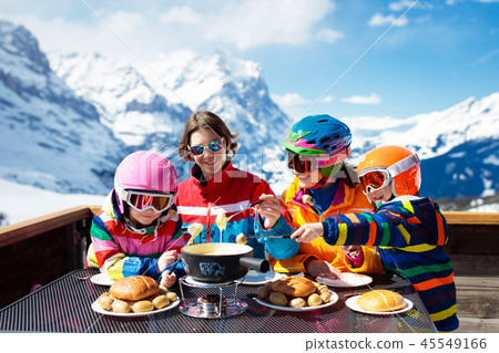 Family apres ski lunch in mountains. Skiing fun. 45549166