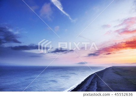 Fantastic beach in southern Iceland, black sand lava. The picturesque sunset with dramatic cumulus Fantastic beach in southern Iceland, black sand lava. The picturesque sunset with dramatic cumulus 45552636