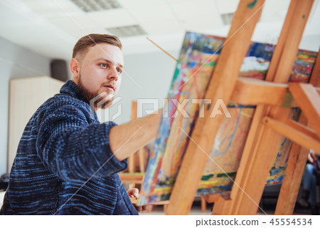 male artist in gallery male artist in gallery 45554534