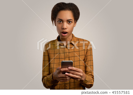 Puzzled and worried dark-skinned beautiful girl 45557581