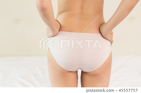 Girl buttocks on white background Girl buttocks on white background 45557757